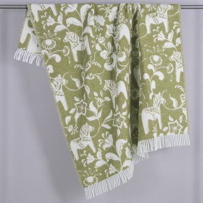 Ullpläd i omvänd färgställning i grönt och vitt med dalahästar