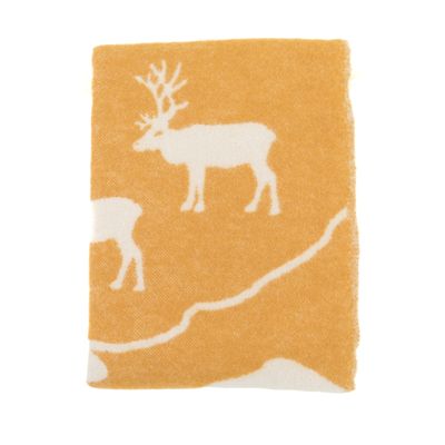 Orange Ullpläd med vita inslag och fjällinspirerat motiv, dekorerad med stilrena fransar.