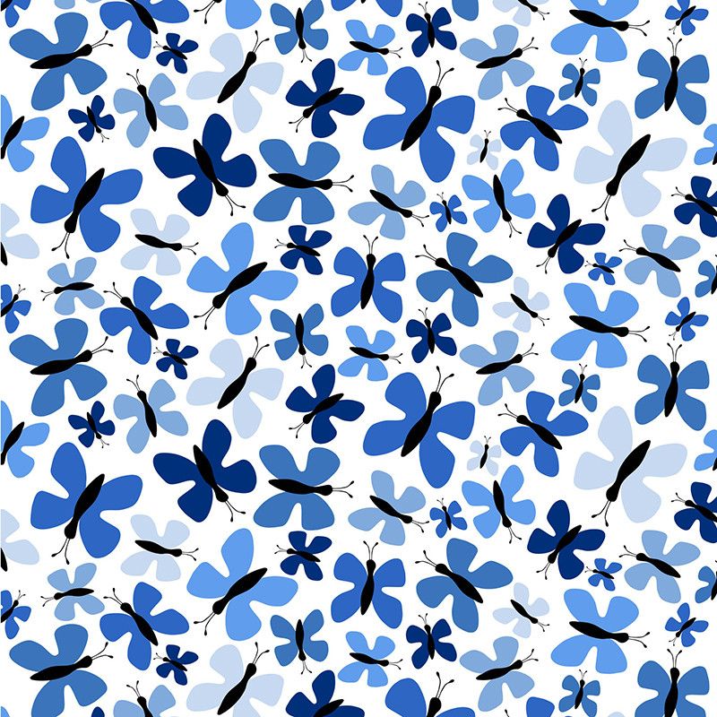 tyg på metervara med vit botten i bomull med blå fjärilar från Arvidssons textil.