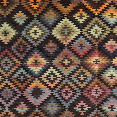 Detalj av Biederlack pläd Nomad Glow med grafiskt mönster i varma jordtoner och geometriska former