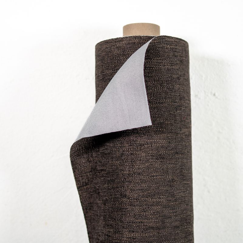 Mörkbrunt möbeltyg med elegant struktur för stilfull möbelklädsel.
