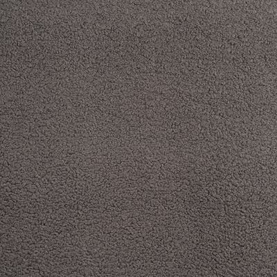 Ljusgrått möbeltyg med mjuk fårpälsliknande struktur i närbild