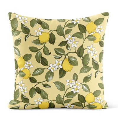 Gult kuddfodral med mönster av citroner, gröna blad och vita blommor