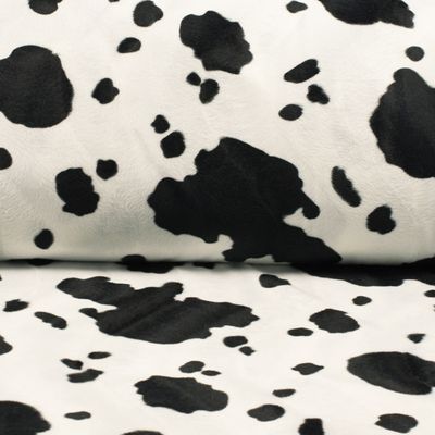 Mjukt ko päls mönstrat i svart och vitt korthårigt pälstyg, för sömnad av kläder, maskerad, käpphäst och inredning