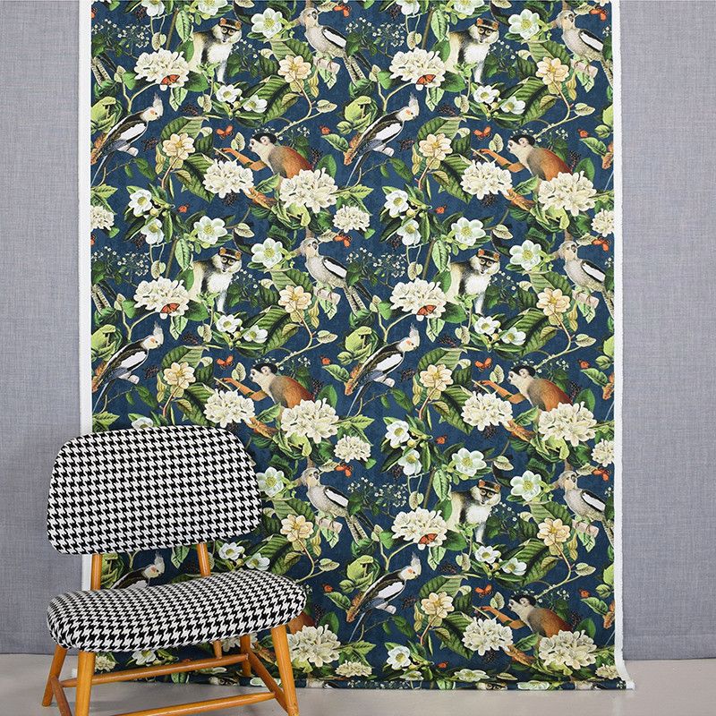 Tropical life curtains and decorative fabrics with print of monkeys and jungel on a dark blue bottom sold by the meter online at nordictextiles.com.