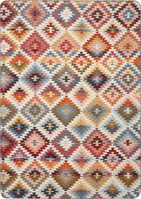 Ljus filt med geometriskt nomadinspirerat mönster i varma och mjuka färgtoner