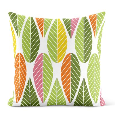 Kuddfodral med gröna och gula blad i retroinspirerat mönster