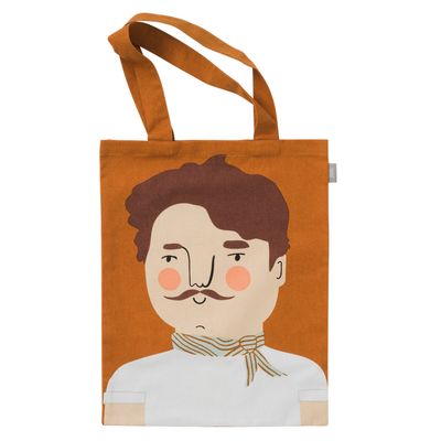 Rostfärgad tygkasse med tryckt motiv av Carlos med mustasch och scarf