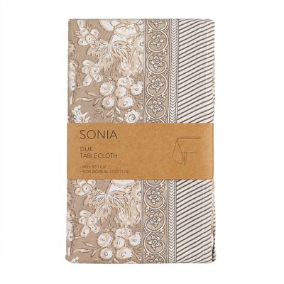 Beige bordsduk Sonia i 100 procent bomull med blommönster och dekorativ bård