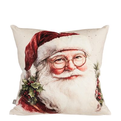 Tomtefar kuddfodral med julmotiv föreställande en leende tomte med röd luva, glasögon och vitt skägg, omgiven av gröna blad och röda bär mot en ljus bakgrund.