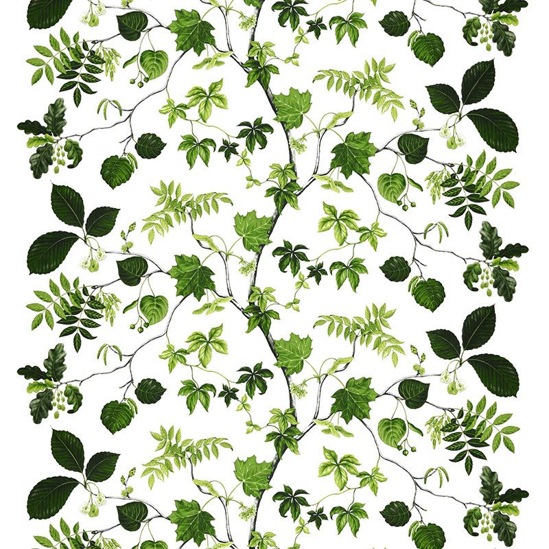 Tyg på metervara med vit botten i bomull med kvistar och blad i olika gröna nyanser från Arvidssons textil.